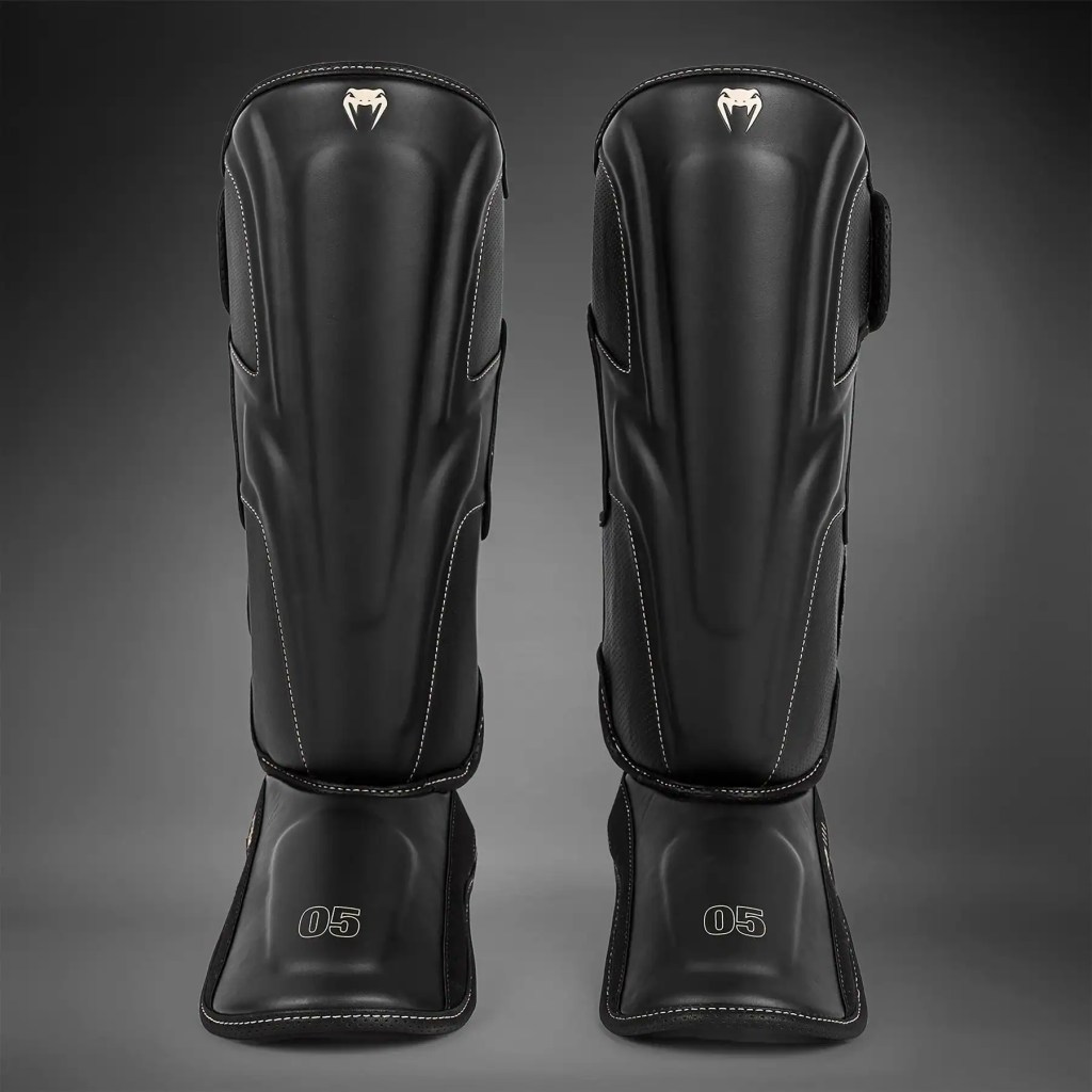 Protège-tibias Venum Impact Evo protection intégrale Muay Thai