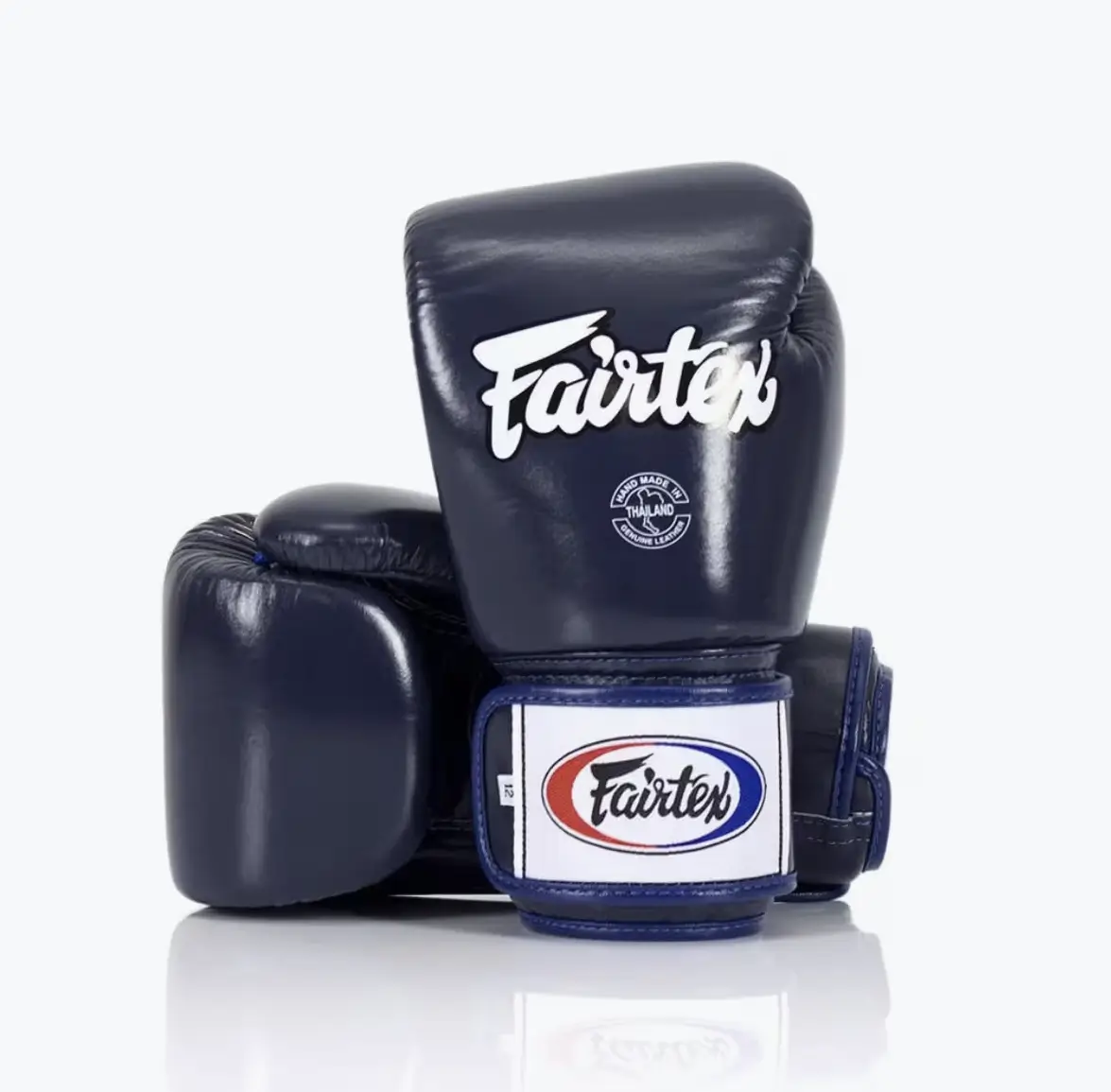 Paire de gants Fairtex BGV1 bleu marine — vue paume et face, coutures renforcées, cuir véritable Tight Fit